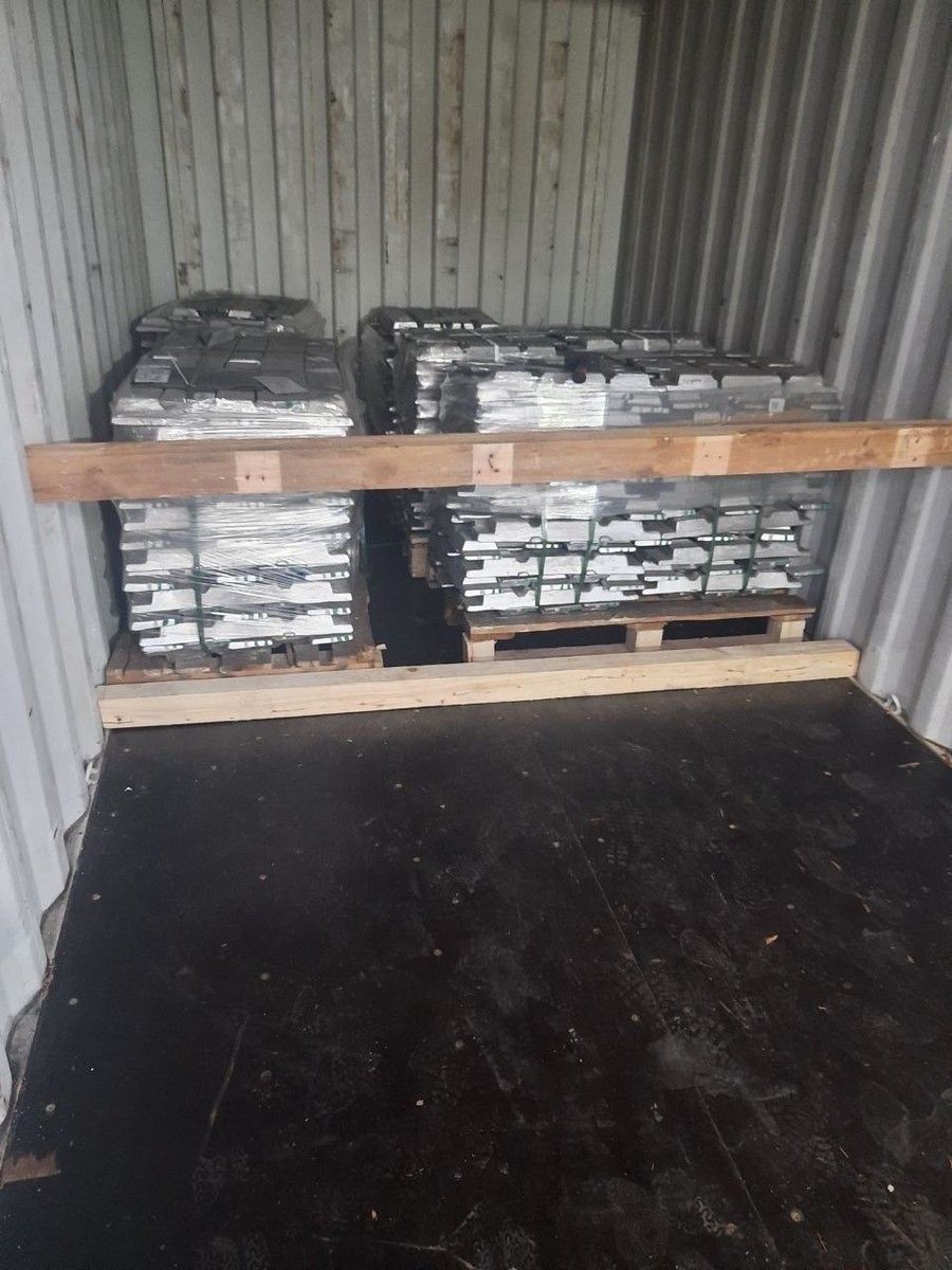Aluminium ingots secured in a container